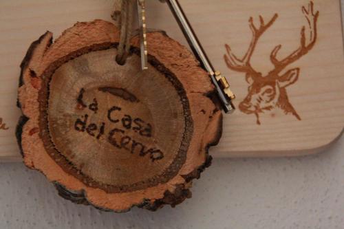 a piece of wood with a deer on it at Casa del Cervo in Ingurtosu