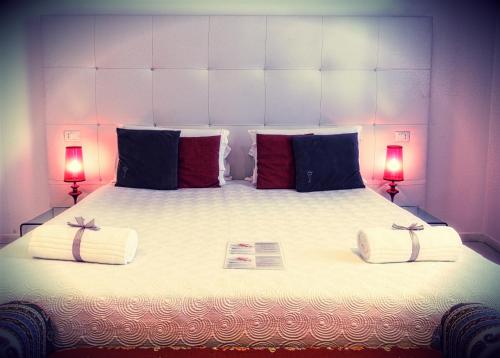 Postel nebo postele na pokoji v ubytování Palco Rooms&Suites