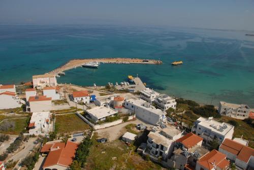 an aerial view of a small island in the water at Hotel Theris in Megalochori