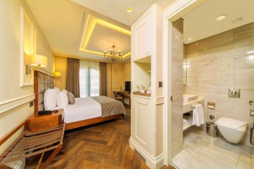 a hotel room with a bed and a bathroom at Hotel Morione & Spa Center in Istanbul