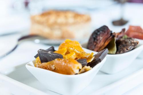 two bowls of food sitting on a table at Palazzo Muro Leccese Relais de Charme & Wellness in Muro Leccese
