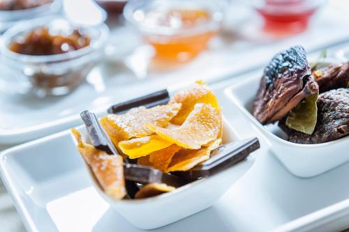 a couple of bowls of food on a table at Palazzo Muro Leccese Relais de Charme & Wellness in Muro Leccese