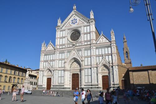 a large church with a clock on the front of it at Casa Martino in Villa