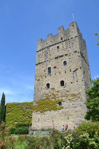 a tall stone building with a blue sky in the background at Casa Martino in Villa