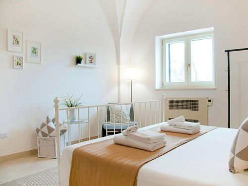 Postel nebo postele na pokoji v ubytování B&B Lamie Di Olimpia