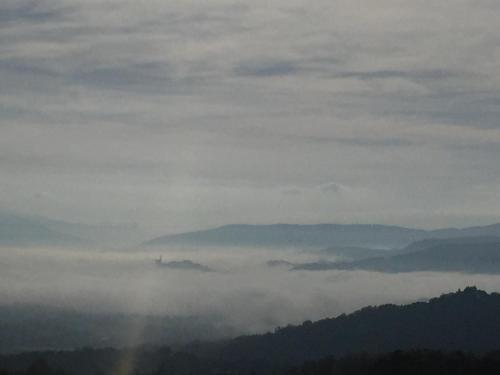a view of a mountain with a rainbow in the clouds at Casa Martino in Villa
