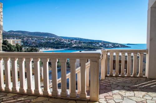 a balcony with a view of the ocean at Vila Vujošević in Utjeha