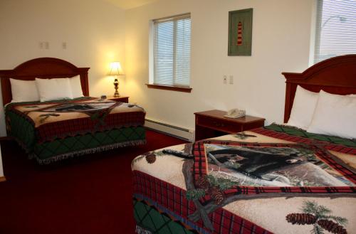 a hotel room with two beds and a telephone at Juneau Hotel in Juneau