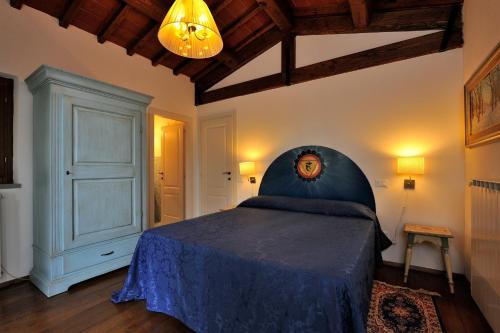 Ένα ή περισσότερα κρεβάτια σε δωμάτιο στο Agriturismo Borgo Nuovo Di Mulinelli
