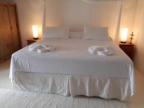 casa curuipe praiaにあるベッド
