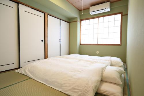 Lova arba lovos apgyvendinimo įstaigoje Hotel Hana Ichirin