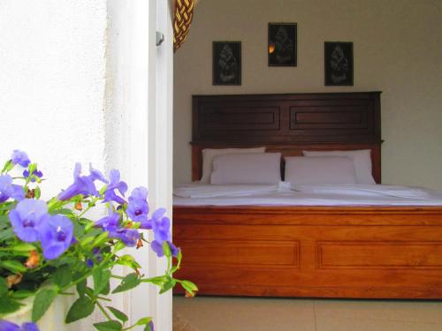 Ліжко або ліжка в номері Kandyan Sweet Villa