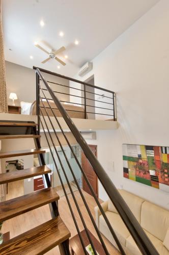 a staircase in a house with a ceiling fan at Palazzo Violetta in Sliema
