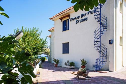 a building with a sign on the side of it at Karfas Bay View in Karfas