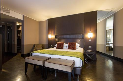 Postel nebo postele na pokoji v ubytování Rome Times Hotel