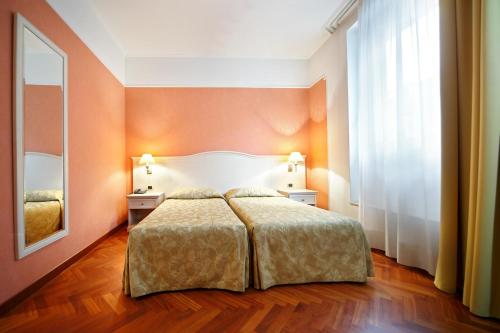 Ένα ή περισσότερα κρεβάτια σε δωμάτιο στο Hotel Terminal