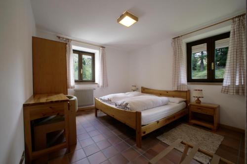 Un pat sau paturi într-o cameră la Hotel Garni Gonzaga