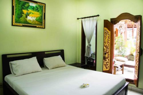 Cama o camas de una habitación en Jungut Inn