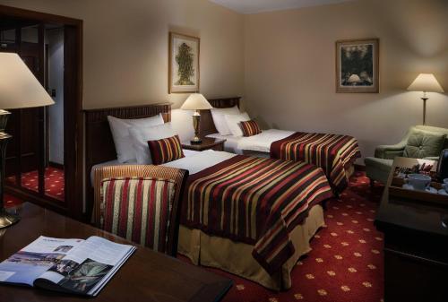 เตียงในห้องที่ Art Nouveau Palace Hotel