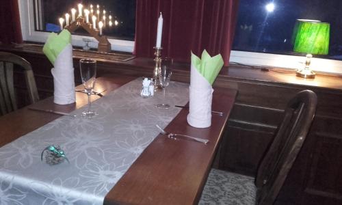 a table with two candles on top of it at Hotel v Nebi in Josefuv dul
