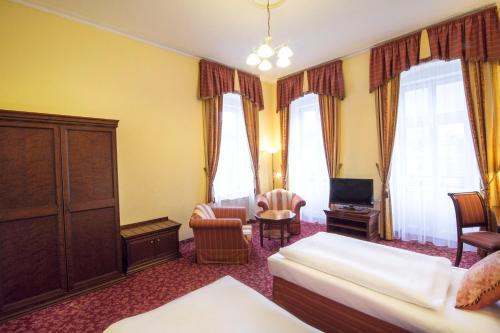 Postel nebo postele na pokoji v ubytování Hotel Ontario