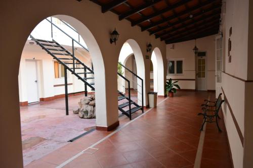 a large brick building with stairs leading to a stairway at Hotel de la Linda in Salta