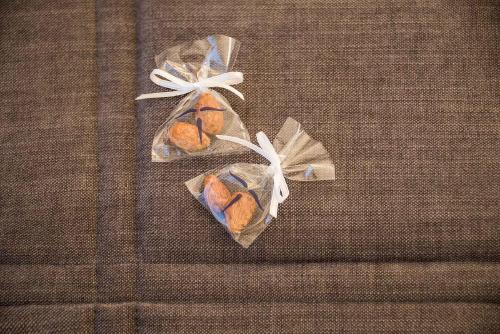 two bags of pastries sitting on top of a couch at Artagonist Art Hotel in Vilnius
