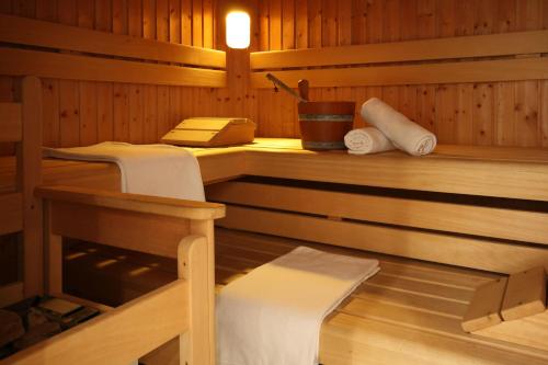 a sauna with a bench and a table in it at Appartementhaus Sonne in Ramsau am Dachstein