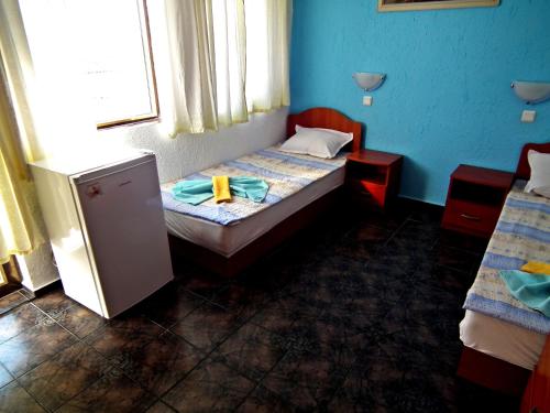 Een bed of bedden in een kamer bij Guest House Olimpiya