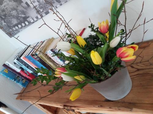 a vase filled with flowers on a table at Das Prinzis in Lofer