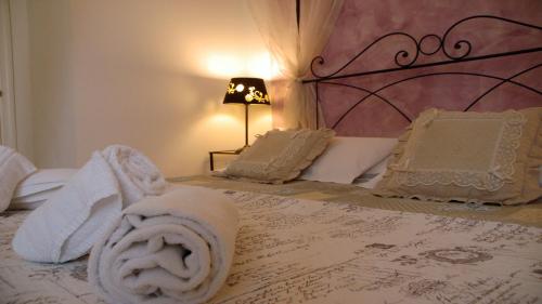 a bedroom with a bed with towels on it at Ridolfi Guest House in Florence