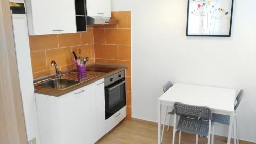 Η κουζίνα ή μικρή κουζίνα στο Residence Hotel Vittoria