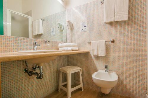 a bathroom with a sink and a toilet at Park Hotel Villa Americana in Rodi Garganico