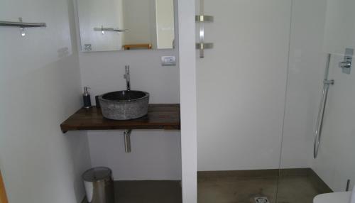 a bathroom with a sink and a mirror at Borgo San Rocco Piemonte in Castino