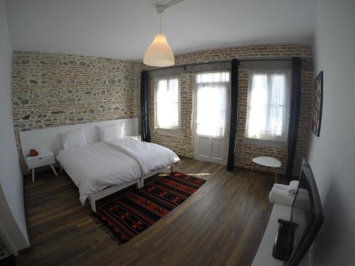 Ένα ή περισσότερα κρεβάτια σε δωμάτιο στο Old Bazaar Rooms