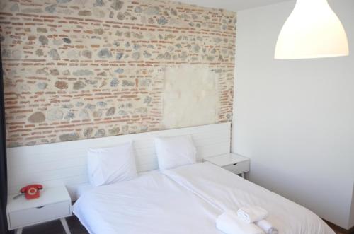 Ein Bett oder Betten in einem Zimmer der Unterkunft Old Bazaar Rooms