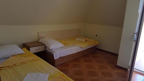A bed or beds in a room at Villa Krisia Apartments