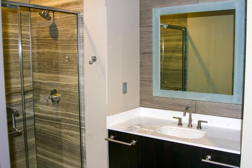 a bathroom with a sink and a shower at River Bend Casino & Hotel in Wyandotte