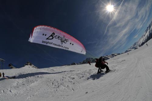 a person on skis on a snow covered slope at Hotel Berghof in Nauders