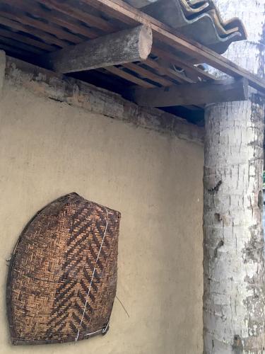 a basket hanging on a wall under a ceiling at Hotel La Felicita in Mirissa