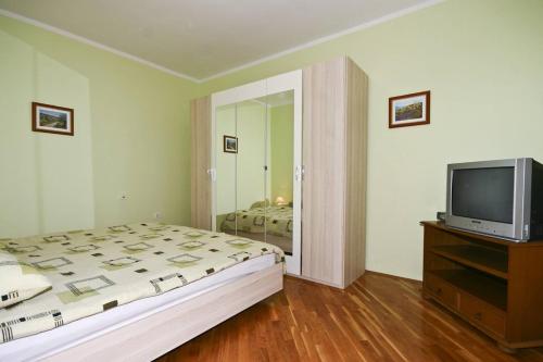Ένα ή περισσότερα κρεβάτια σε δωμάτιο στο Apartment Casa Robi