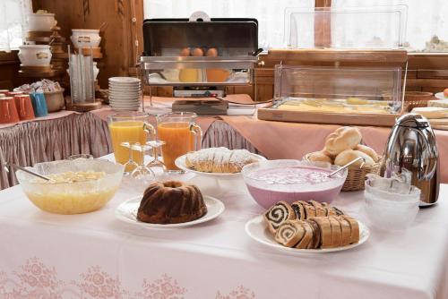 a table topped with different types of pastries at Pension Singer in Innsbruck