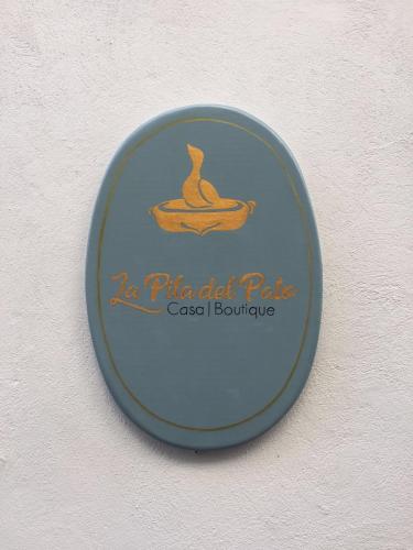 a plate with a dog in a bowl on a wall at Casa Boutique La Pila del Pato in Seville