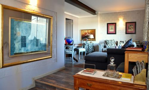 a living room with a couch and a table at Dieu Donne in Stellenbosch