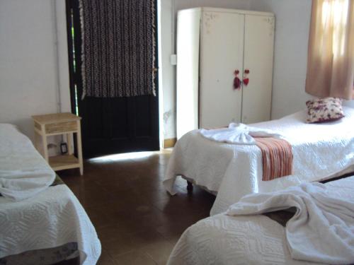 Una cama o camas en una habitación de Hostería Bello Horizonte