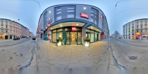 a large building on a city street at ibis Hotel München City in Munich