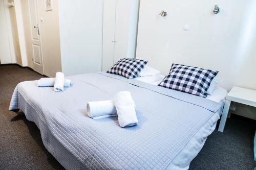 
Łóżko lub łóżka w pokoju w obiekcie Apartamenty Centrum Ivy
