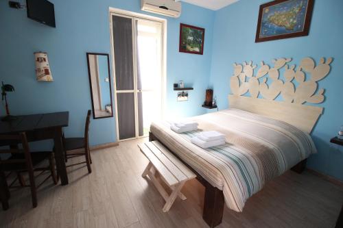 Postel nebo postele na pokoji v ubytování B&B San Leone