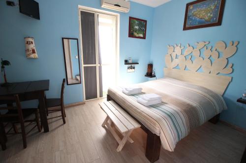 מיטה או מיטות בחדר ב-B&B San Leone