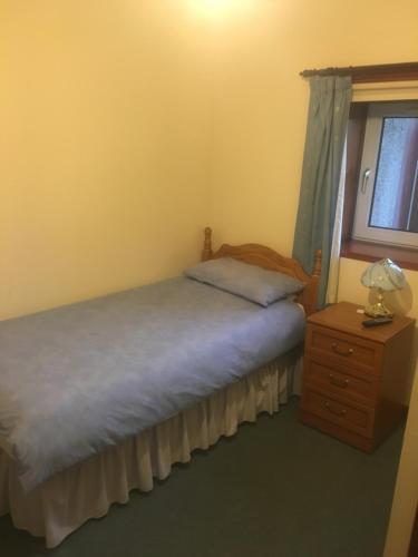 Een bed of bedden in een kamer bij Invernettie guesthouse